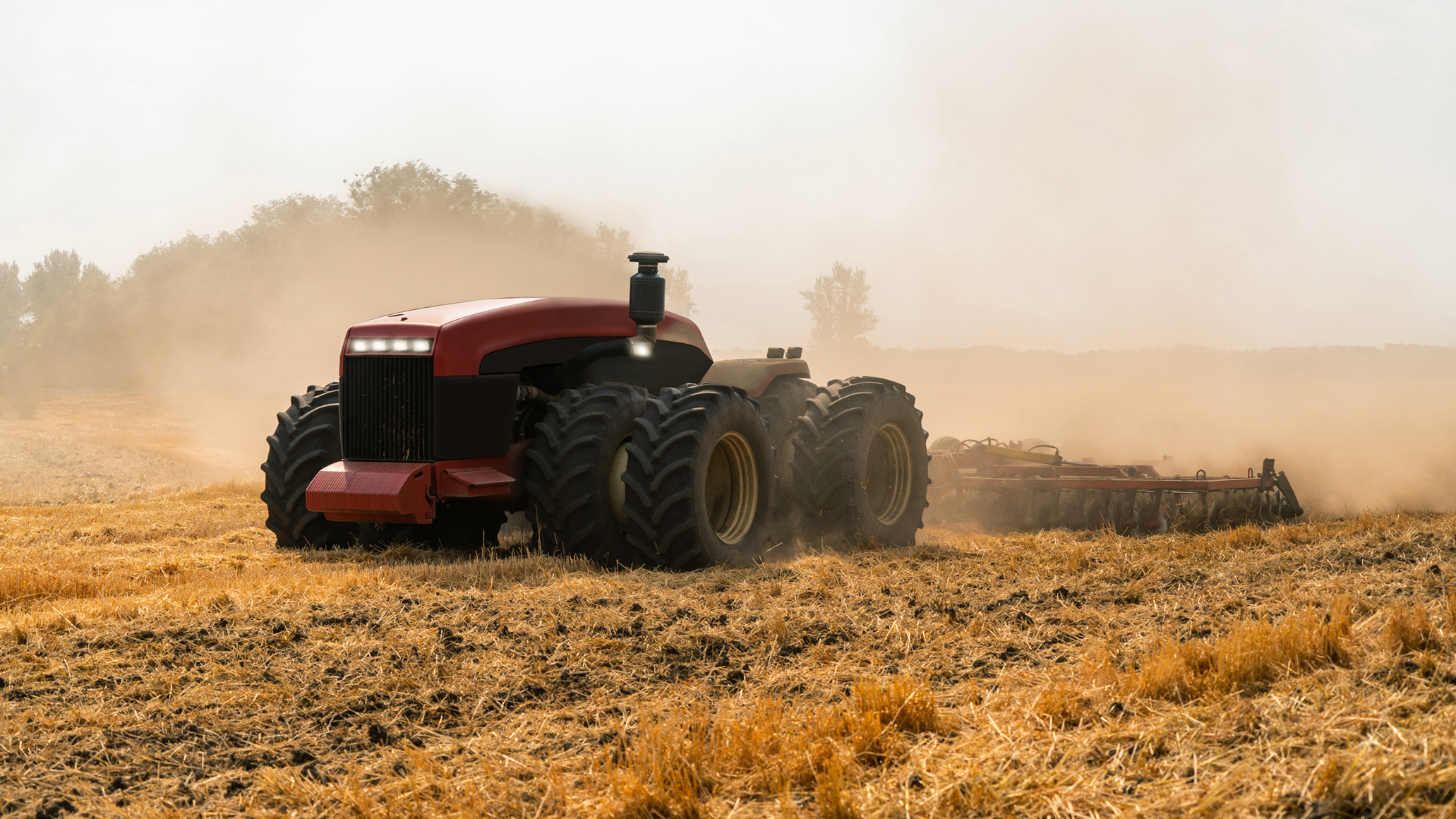 A tractor in a fieldDescription automatically generated
